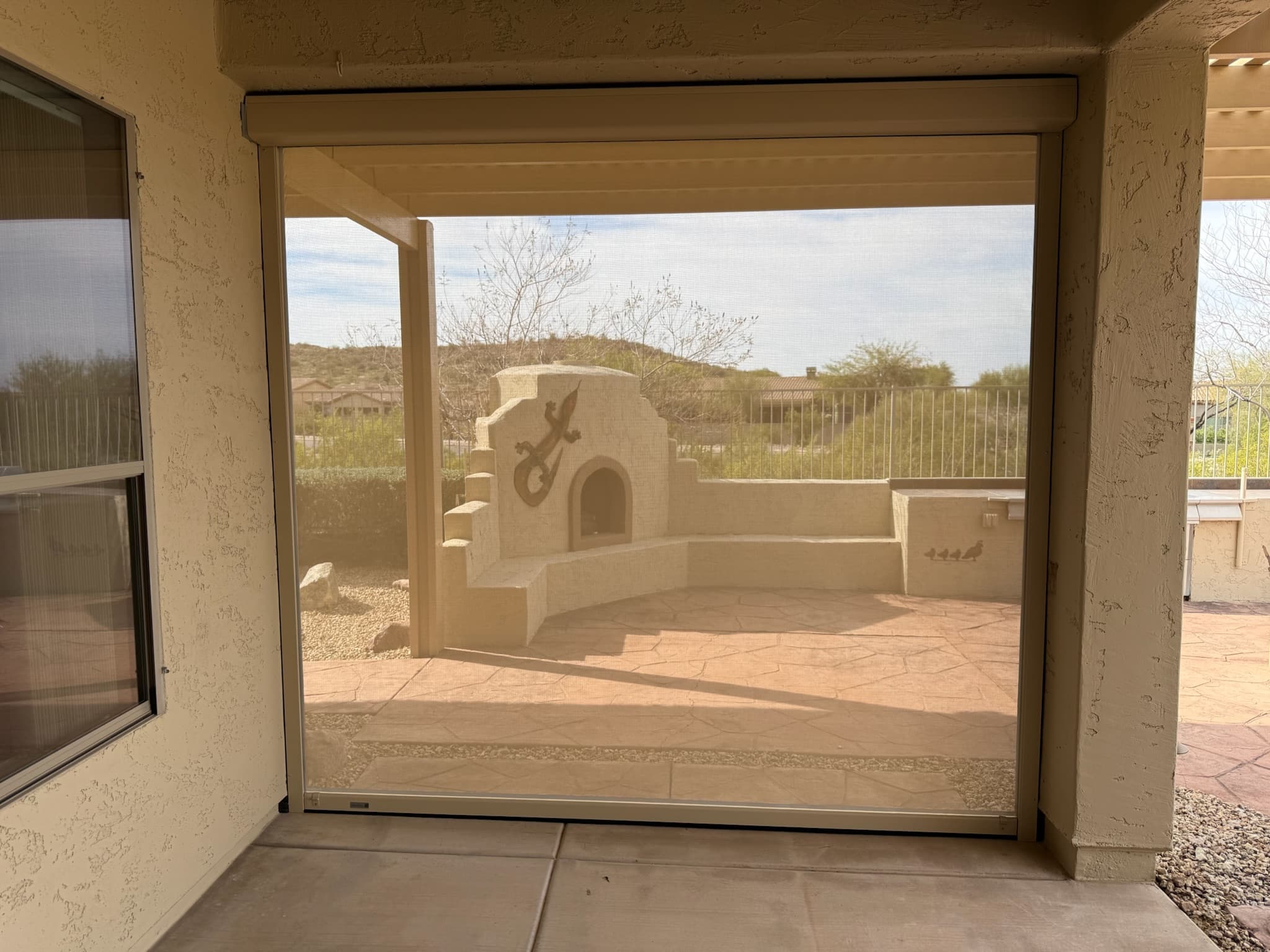 Backyard patio shades lowered on a Phoenix home